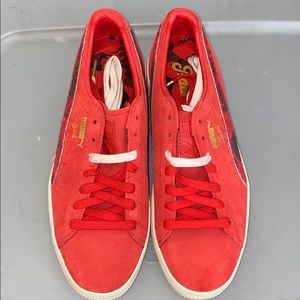 Men’s red puma shoes.